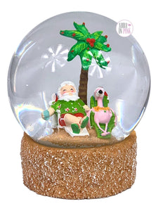Tropical Palm Tree Santa & Pink Flamingo Beach Loungers Iridescent Glitter Glass Snow Globe w/Sandy Base - Aura In Pink Inc.